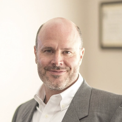 A headshot of Dr. Toby Weig, a chiropractor at Weig Chiropractic Center